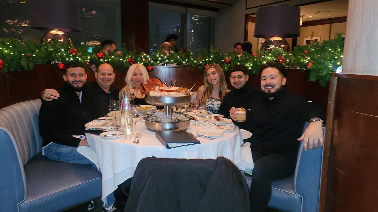 Family photo at a dinner table